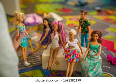 Budapest, Hungary / April 1, 2019 - Young Girl Playing With Her Barbie Toy Dolls Of Diverse Variety. Educating Diversity Concept. Illustrative Editorial.