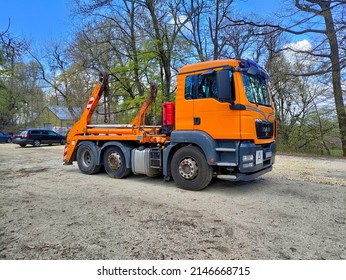 Budapest, Hungary - April 11, 2022: Orange Tractor Without A Trailer Parked In The Park.