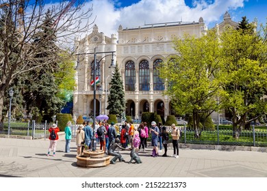 BUDAPEST, HUNGARY - APRIL 25, 2022: Palác Vigadó - Concert Hall, Bronze Statues Of Raffay David Of A Girl That Plays With A Dog, Budapest, Hungary, Europe