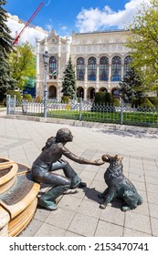 BUDAPEST, HUNGARY - APRIL 25, 2022: Palác Vigadó - Concert Hall, Bronze Statues Of Raffay David Of A Girl That Plays With A Dog, Budapest, Hungary, Europe