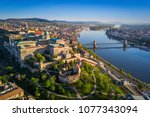 Budapest, Hungary - Beautiful aerial skyline view of Buda Castle Royal Palace and South Rondella at sunset with Szechenyi Chain Bridge over River Danube, Matthias Church and Parliament of Hungary