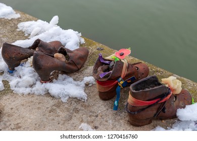 Budapest, Hungary - December 19, 2018: Shoes On The Danube Shore Are A Monument Created In Memory Of The Jews Killed During The Second World War By The Arrow Cross Party Soldier's Between 1944-1945.