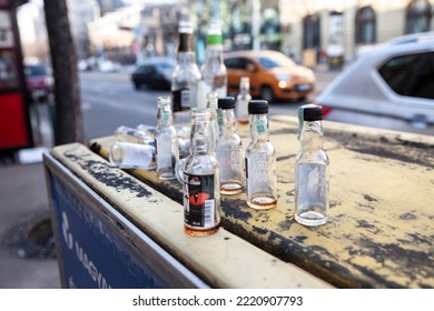 BUDAPEST, HUNGARY - FEBRUARY 27, 2022: Selective Blur On Empty Miniature Alcohol Bottles Scattered In A Street Of Budapest After A Hunge Binge Drinking Party.

