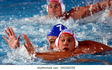 Budapest, Hungary - Jul 14, 2014. Balazs Sziranyi (ESP, 7) and Adam Decker (HUN, 7) fighting for the ball.The Waterpolo European Championship was held in Alfred Hajos Swimming Centre in 2014.
