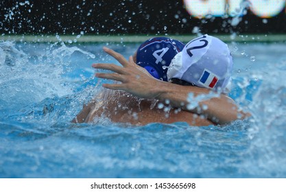 Budapest, Hungary - Jul 14, 2014. Alexandre CAMARASA (FRA, 12) and Sava RANDJELOVIC (SRB, 4) wrestling in the pool. Waterpolo European Championship was held in Alfred Hajos Swimming Centre in 2014.