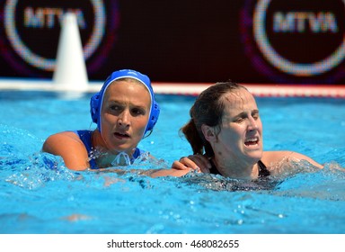 Budapest, Hungary - Jul 16, 2014. TSOUKALA Christina (GRE 2) defending against  WINSTANLEY-SMITH Angela (GBR 10). The Waterpolo European Championship was held in Alfred Hajos Swimming Centre in 2014.