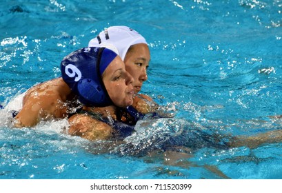Budapest, Hungary - Jul 16, 2017. TOTH Ildiko (HUN) fights with  TOKUMOTO Marina (JPN) in the preliminary round. FINA Waterpolo World Championship was held in Alfred Hajos Swimming Centre in 2017.