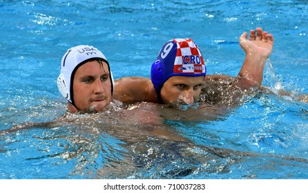 Budapest, Hungary - Jul 17, 2017. SUKNO Sandro (CRO) playing against  ROELSE Alex (USA) in the preliminary round. FINA Waterpolo World Championship was held in Alfred Hajos Swimming Centre in 2017.
