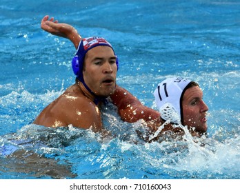 Budapest, Hungary - Jul 17, 2017. KRAPIC Ivan (CRO) playing against ROELSE Alex (USA) in the preliminary round. FINA Waterpolo World Championship was held in Alfred Hajos Swimming Centre in 2017.