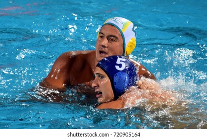 Budapest, Hungary - Jul 17, 2017. VAMOS Marton hungarian waterpolo player (in blue) fights with KAYES Joe (AUS). FINA Waterpolo World Championship was held in Alfred Hajos Swimming Centre in 2017.