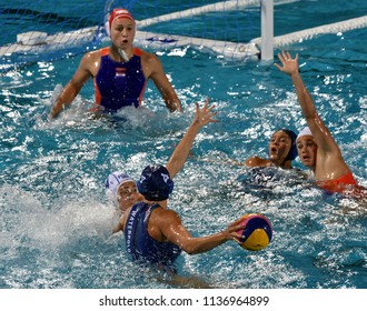 Budapest, Hungary - Jul 20, 2017.  van der SLOOT Sabrina (NED) and WILLEMSZ Debby (NED) goalkeeper defend against GURISATTI Greta (HUN) in the preliminary round of FINA Waterpolo World Championship.