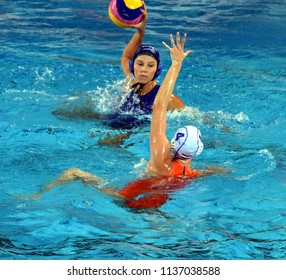 Budapest, Hungary - Jul 20, 2017. ILLES Anna (HUN) fights against van der SLOOT Sabrina (NED) for the ball in the preliminary round of FINA Waterpolo World Championship.