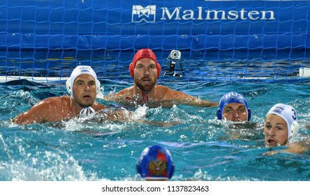 Budapest, Hungary - Jul 25, 2017. Hungarian waterpolo team (NAGY Viktor goalkeeper, MANHERCZ Krisztian, HOSNYANSZKY Norbert) defend against russian player (DEREVIANKIN Nikita).
