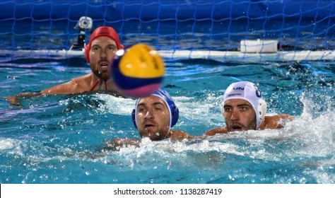 Budapest, Hungary - Jul 25, 2017. GOR-NAGY Miklos (HUN) defends against LISUNOV Sergey (RUS). NAGY Viktor (HUN) in the background. FINA Waterpolo World Championship Quarterfinal. 
