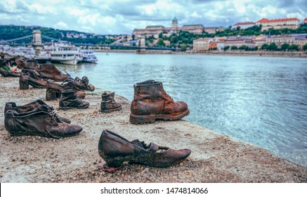 Budapest / Hungary - July 14 2019: Old Metal Rusty Shoes On The Parapet Of The Danube River Embankment In Budapest, Hungary. Monument To The Victims Of  Repression, Jews Killed During The Nazi Terror