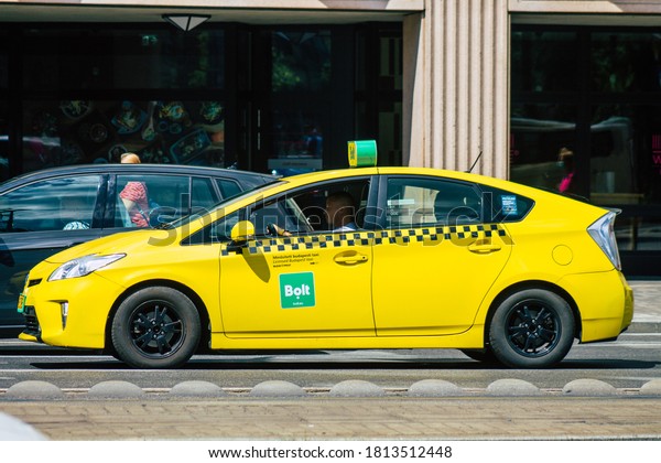 Budapest Hungary\
july 15, 2020 View of a traditional yellow Hungarian taxi for\
passengers driving through the streets of Budapest the capital and\
the most populous city of\
Hungary