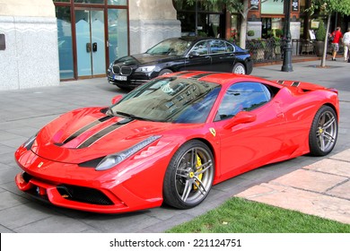 BUDAPEST, HUNGARY - JULY 23, 2014: Red supercar Ferrari 458 Italia Speciale at the city street.