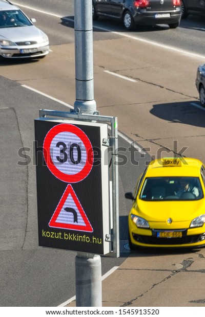 BUDAPEST,\
HUNGARY - MARCH 2019: Electronic sign showing drivers the speed\
limit on a road in Budapest city\
centre.