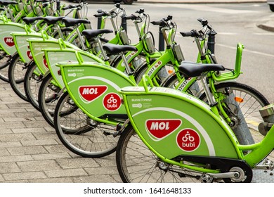 Budapest, Hungary - March 25, 2018: Public Green Bicycles To Rent In The Center Of The Hungarian City. Bike-sharing. Ecological Means Of Transport. Measure In The Towns Against Air Pollution. Bikes