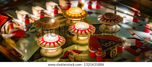 Budapest, Hungary - March 25, 2018: Pinball game\
museum. Pinball machine table close up view of retro vintage ball\
arcade