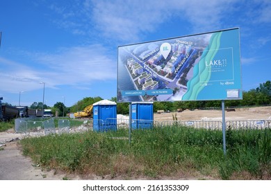 Budapest, Hungary - May 22, 2022: A Sign Announcing The Construction Of A New Residential Apartment House Park On A Building Plot Site In Budapest Suburb Koerberek