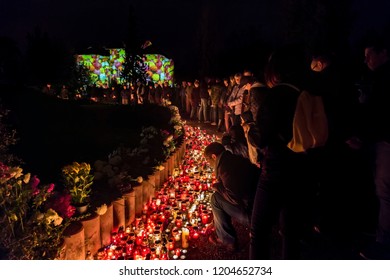 BUDAPEST, HUNGARY - NOVEMBER 1, 2017: All Saints Day at the Budapest Farkasret Cemetery.People place candles and bouquets in memory of their dead.