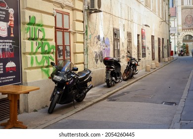 Budapest, Hungary - October 4, 2021: Old Empty Downtown Street With Parking Motorcycles In Budapest