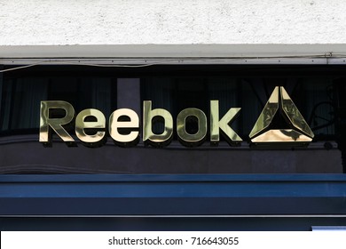Budapest, Hungary, September 13, 2017: Reebok logo on a building. Reebok is a global athletic footwear and apparel company. Reebok produces and distributes fitness, running and CrossFit sportswear.
