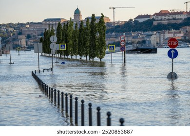 Budapest, Hungary - September 19, 2024: Rising Waters Flood the Highway Outside Budapest's Parliament in the Aftermath of Storm 'Boris'. Buda castle in the background. - Powered by Shutterstock