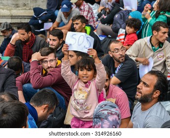 BUDAPEST, HUNGARY - SEPTEMBER 5, 2015 : Refugees at the Keleti Railway Station on 5 September 2015 in Budapest, Hungary. Refugees are arriving constantly to Hungary on the way to Germany.