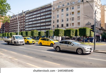 Budapest, Hungary-June 2019. People in the street of the city with then skyscraper and the tipycal european architeture in a sunny day.