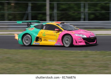 BUDAPEST - JULY 3: Renault Megane Race Car Blowing Fire On The Hungaroring Race Track At World Series By Renault On July 3, 2011 In Budapest, Hungary