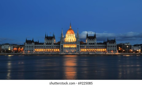 Budapest Parliament Building On The Danube Banks At Night