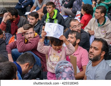 BUDAPEST - SEPTEMBER 5 : War refugees at the Keleti Railway Station on 5 September 2015 in Budapest, Hungary. Refugees are arriving constantly to Hungary on the way to Germany.