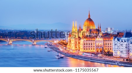 Budapest skyline, Hungary - illuminated Hungarian Parliament in twilight. Spectacular Panoramic view on Danube river delta and bridge. Famous European travel destination. 