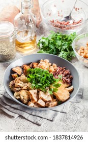 Buddha Bowl Lunch With Chicken And Red Rice, Chickpea, Cauliflower And Halloumi Cheese. Healthy Food Concept