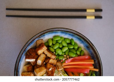 Buddha Bowl Recipe With Tofu, Edamame, Rice Noodles And Carrot. Top View.