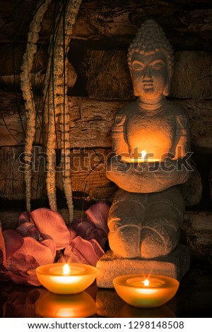 Buddha with candle