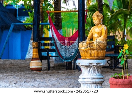 Buddha figure statue sculpture made of wood stone in Playa del Carmen Quintana Roo Mexico.