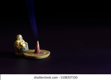 Buddha figurine with incense - Powered by Shutterstock