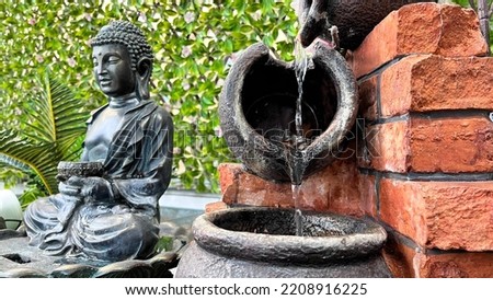 Buddha Buddha fountain. sand zen garden buddha spring buddha statue place of meditation