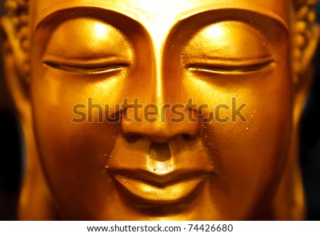 Buddha gold statue close-up