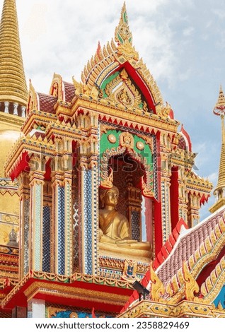 Buddha image at one of the buildings at Wat Huai Yai, a Buddhist temple in Huai Yai, Pattaya City, Chonburi, Thailand.