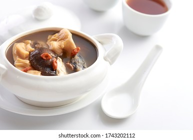 Buddha Jump Over The Wall,  Chinese Herbal Soup With Premium Dry Seafood In White Background