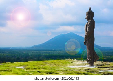 Buddha looking seven day style and sun back cloud over mountain background, Makha Bucha Day is held full moon day on february or march