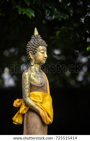 Buddha statue on green background.Buddha statue used as amulets of Buddhism religion.
