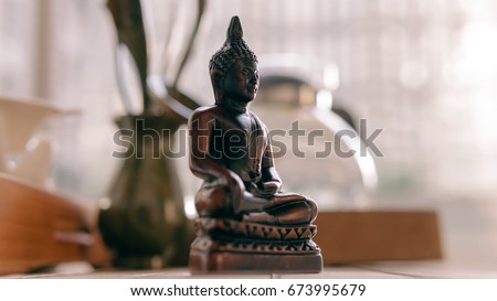 Buddha statue at the tea ceremony close-up