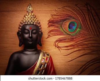 Buddha statue with wooden background and peacock featherwallpaper image with peacock feather and smiling buddhapeaceful image of buddha meditating with wooden backdrop