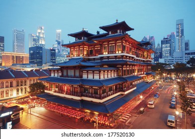 Buddha Toothe Relic Temple in Chinatown in Singapore, with Singapore`s business district in the background. 