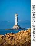 Buddhaism Guanyin statue at seaside in nanshan temple, hainan island , China, Words mean mercy and blessing.